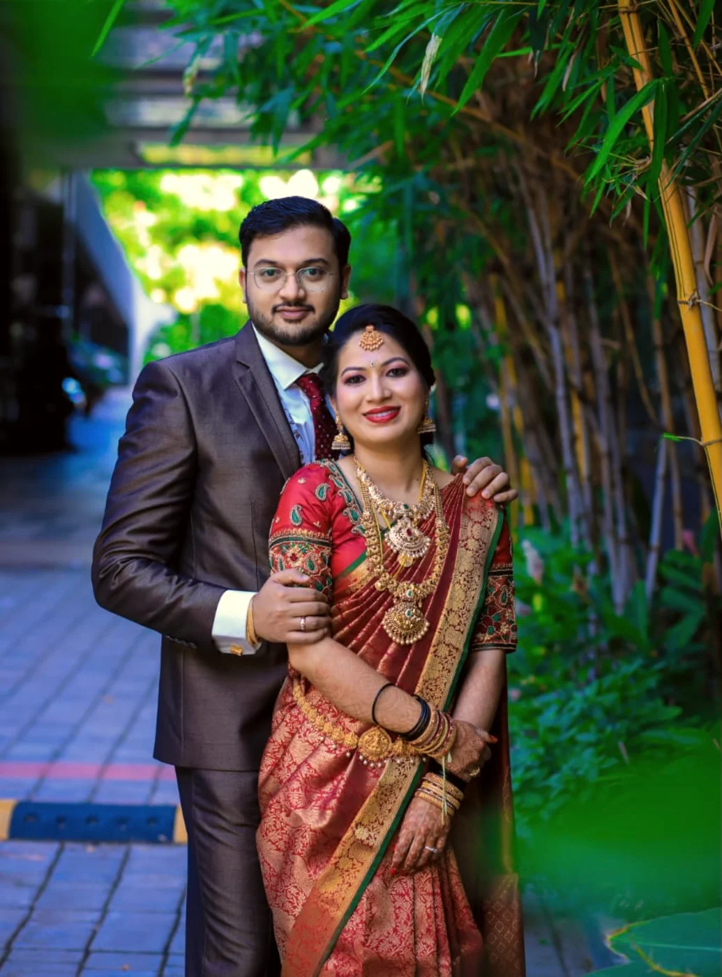 Newly married couple in traditional silk with garlands, Anubhandhaa Bangalore