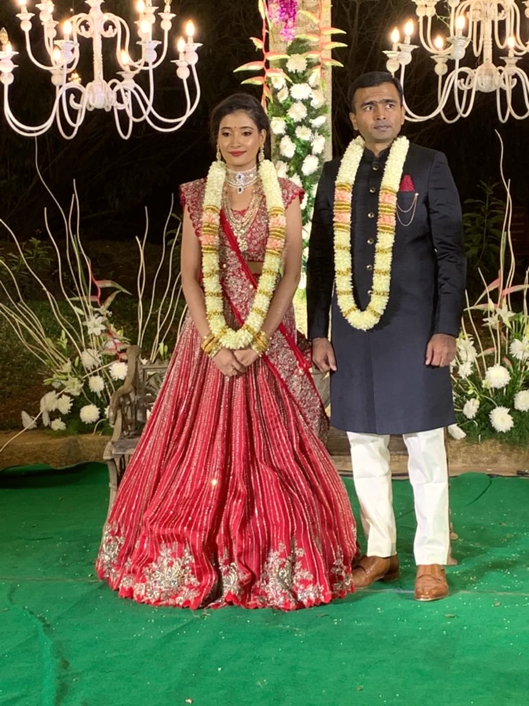 Bride and groom exchanging garlands at a Bangalore wedding, Anubhandhaa