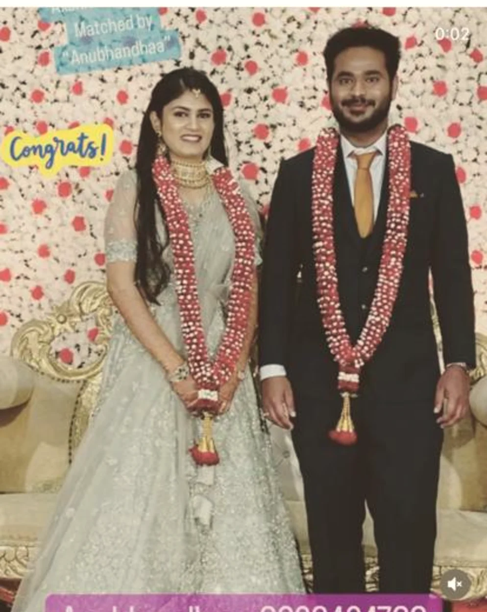Bride and groom garlanded in red roses at their reception, Anubhandhaa Bangalore
